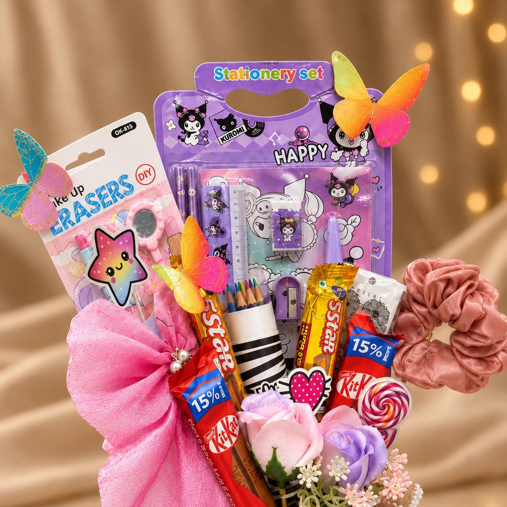 Close-up of the birthday gift hamper: stationery set, make-up eraser set, colour pencils, KitKat, 5 Star and satin scrunchie