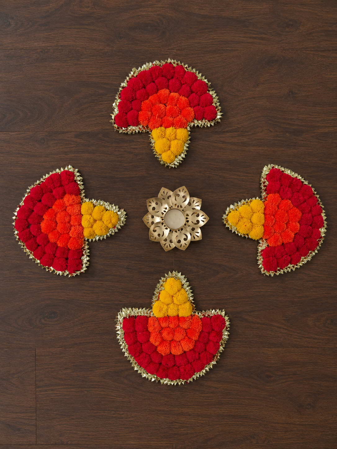 Diya Rangoli Set: four pom-pom diya pieces with gota borders around a gold lotus tealight diya – Giftra
