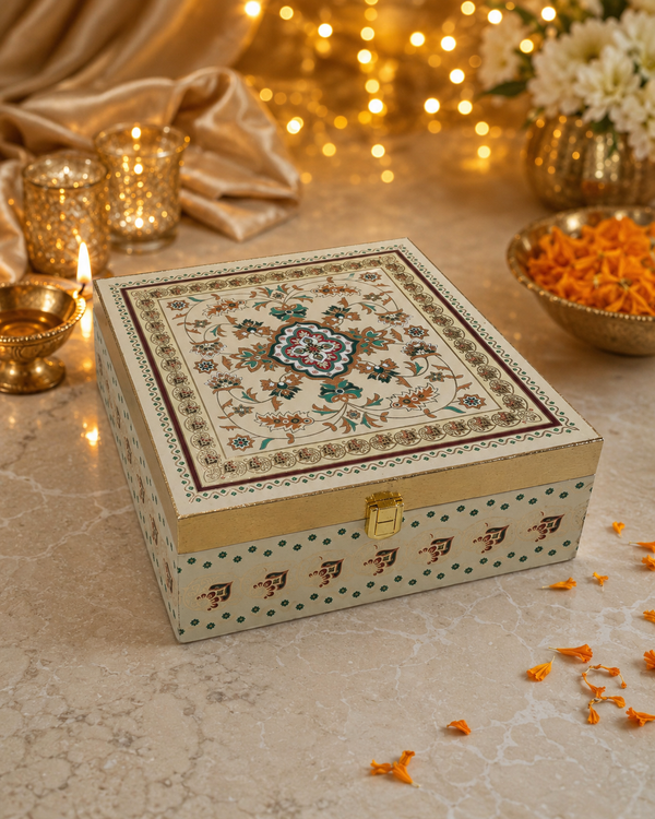 Meenakari wooden dry fruit gift box with hand-painted ivory and gold artwork, closed with gold latch