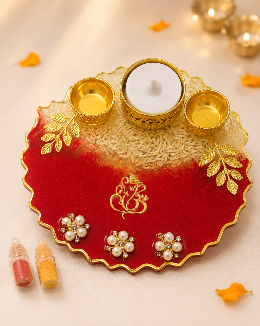 Red Ganesha resin pooja thali with roli, chawal and diya for Raksha Bandhan