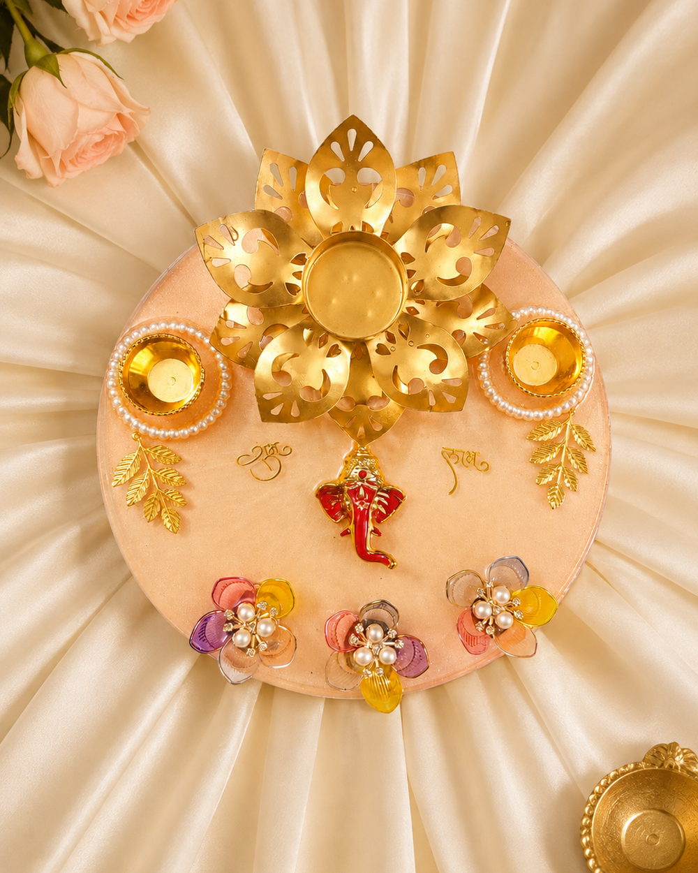 Top view of the resin aarti thali showing gold lotus tealight holder, Shubh Labh lettering and pearl-rimmed katoris