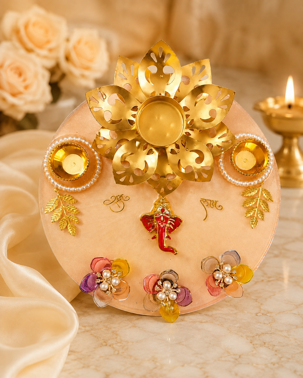 Handmade 8 inch peach and gold resin pooja thali with lotus diya stand, pearl katoris and Ganesha motif