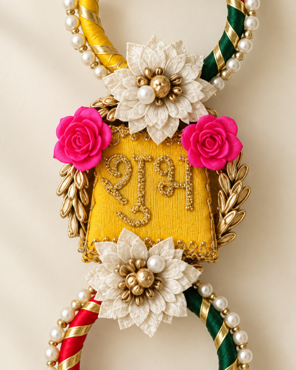 Close-up of the embroidered Shubh panel with gota leaves, pink roses and pearls