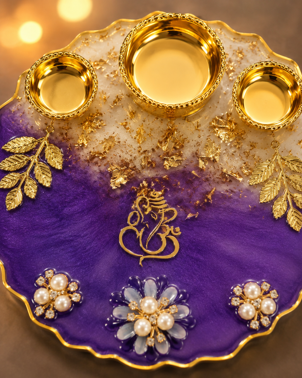 Close-up of the violet and ivory resin pour with gold leaf flakes and filigree gold katori rim